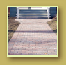 New brick path leads to front entrance of classic brick home