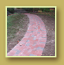 Multicolored pavers add interest to an entrance walkway