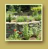 Curving stone walls turn a plain hillside into a gorgeous garden.